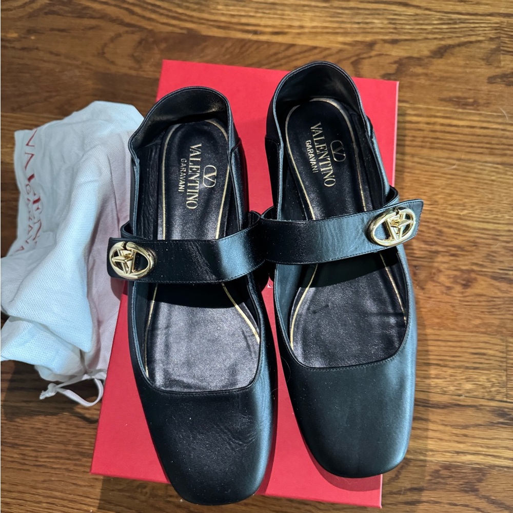 Valentino Black Flats Timeless Elegance